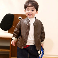 Boys brown PU leather jacket worn open