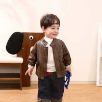 Toddler wearing brown PU leather jacket